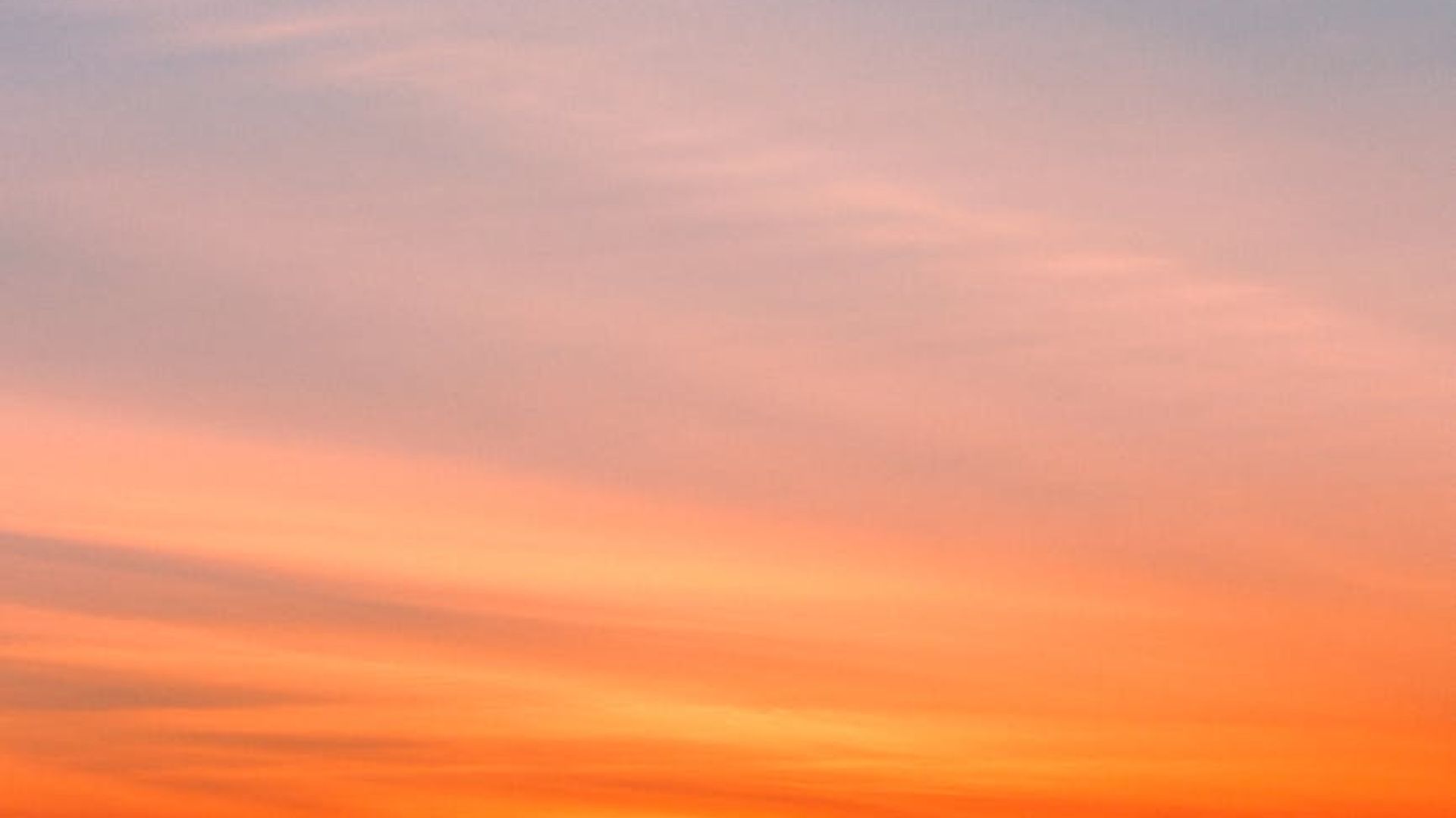 A serene landscape at dawn with soft light, representing peace and new beginnings.